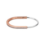 Bracelet jonc étroit en or rose et blanc 18 carats et pavé de diamants demi-cercle