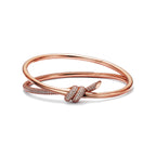 Bracelet jonc double rang à charnière en or rose 18 carats et diamants