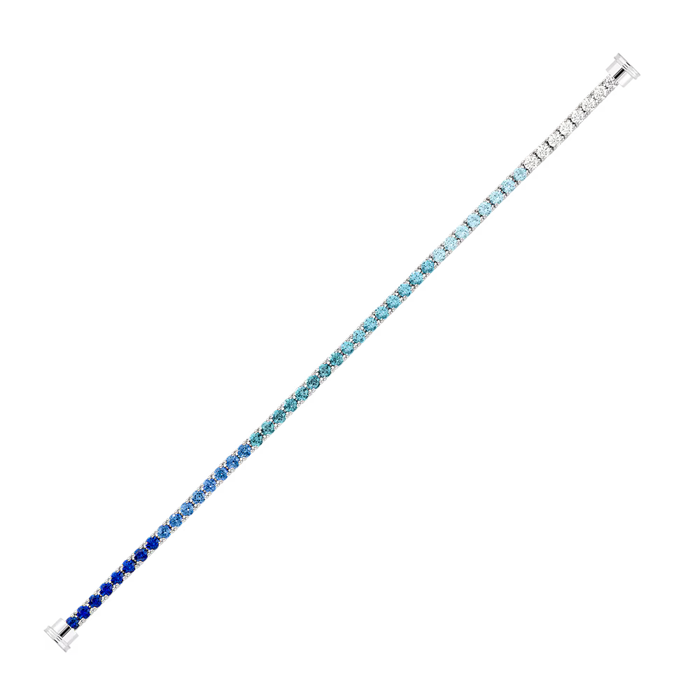 Grand modèle ligne pavée de pierres de couleurs et embouts en or blanc 750/1000e