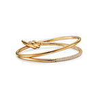 Bracelet jonc double rang à charnière en or jaune 18 carats et diamants