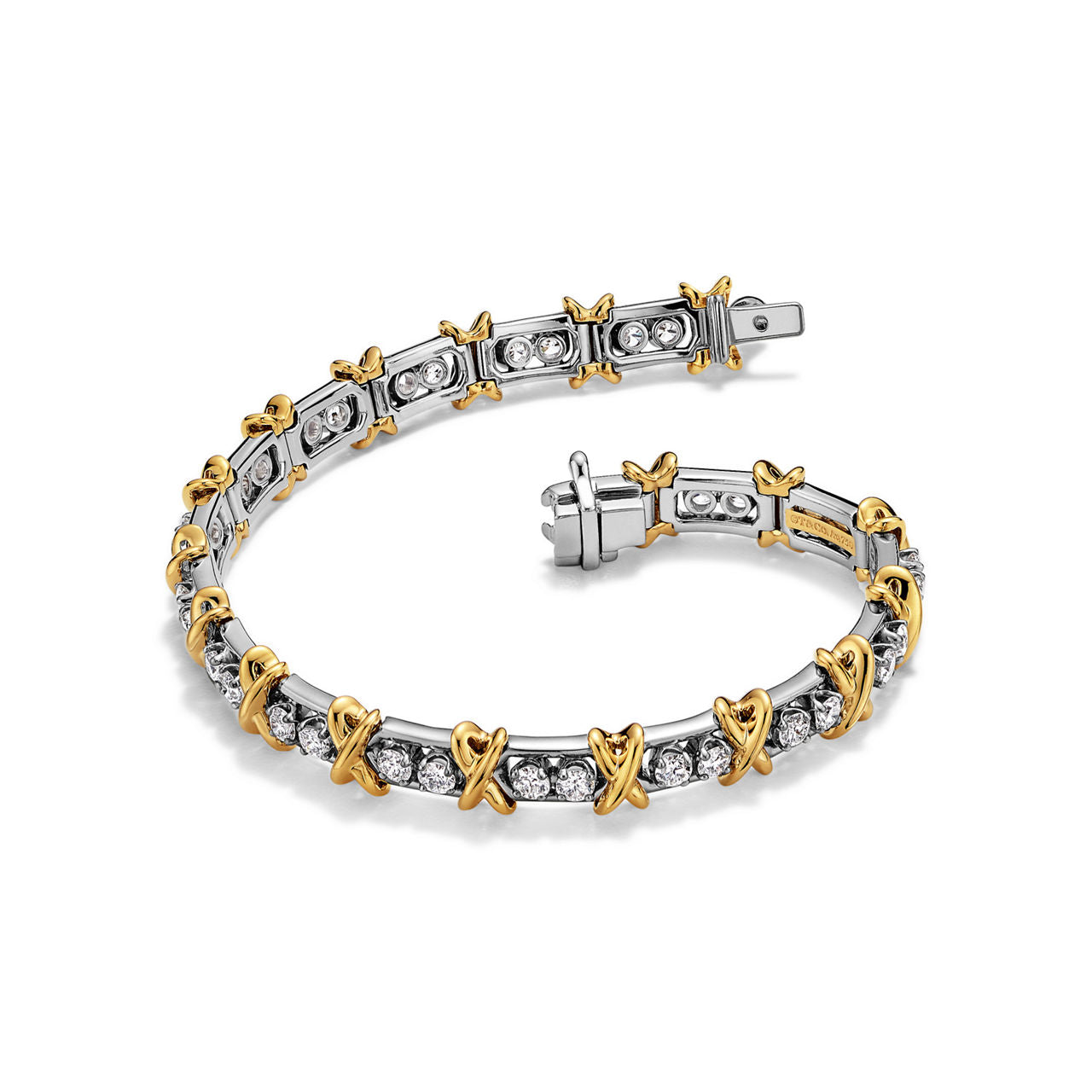 Bracelet en platine 950 millièmes, or jaune et diamants