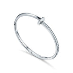 Bracelet jonc à charnière étroite T1 orné de diamants en or blanc 18 carats