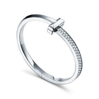 Bracelet jonc à charnière large T1 orné de diamants en or blanc 18 carats
