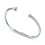 Bracelet jonc à charnière étroite T1 orné de diamants en or blanc 18 carats