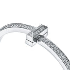 Bracelet jonc à charnière large T1 orné de diamants en or blanc 18 carats