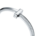Bracelet jonc à charnière large T1 orné de diamants en or blanc 18 carats