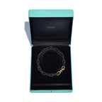 Collier en titane, or 18 carats et diamants